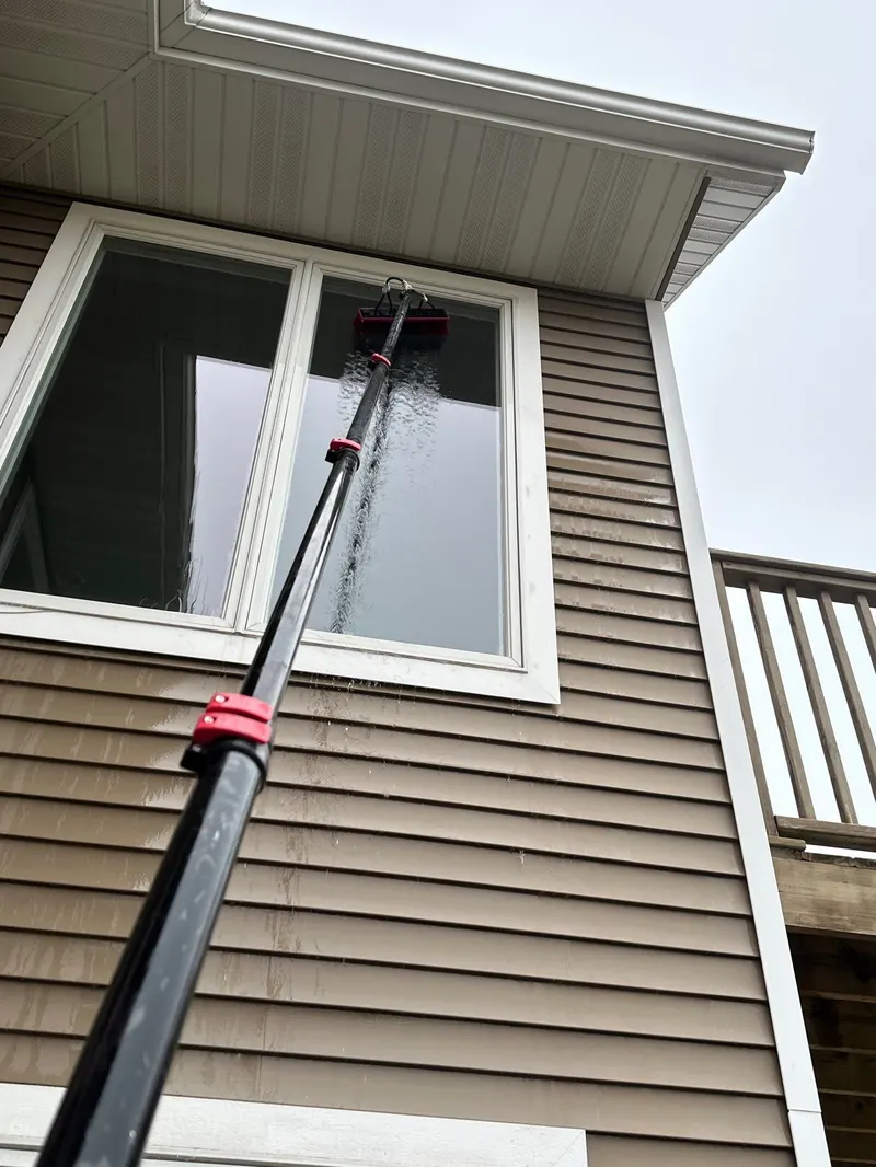 Two-story window cleaning by The Total Wash Co.